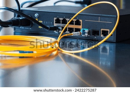 Network technologies. Switch with optical fiber cables.