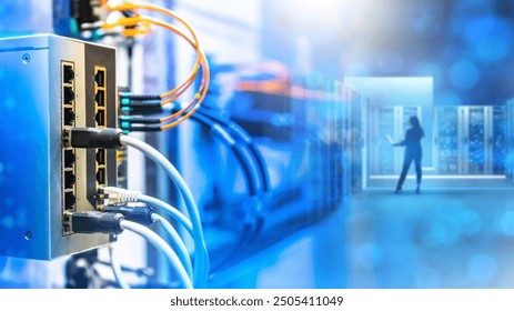 Network technologies. Telecommunications center. Internet switch in server room. Hosting center with woman inside. Switch for distributing load on servers. Data processing technologies - Powered by Shutterstock