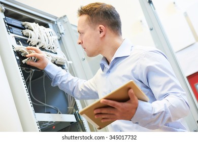 Networking Service. Network Engineer Administrator Checking Server Hardware Equipment Of Data Center