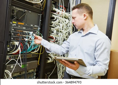 Networking Service. Network Engineer Administrator Checking Server Hardware Equipment Of Data Center