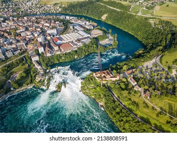 Neuhausen, Switzerland - June 26. 2021: Aerial photography with drone of Rhine Falls with Schloss Laufen castle, Switzerland. Rhine Falls is the largest waterfalls in Europe