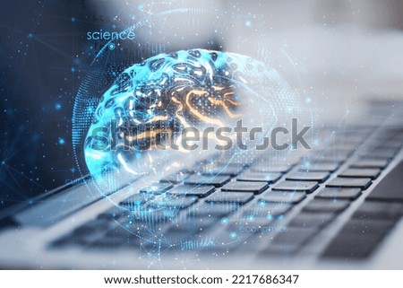 Neural network and artificial intelligence concept with digital human brain with glowing yellow convolutions in blue sphere on modern laptop keyboard background, double exposure