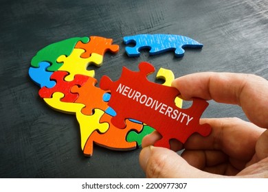 Neurodiversity Concept. Brain From Puzzle And A Hand Holds A Piece With An Inscription.