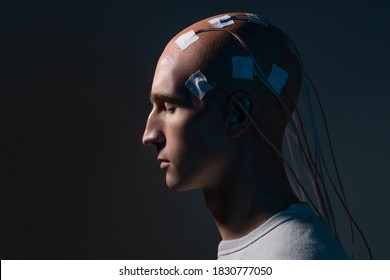 Neurointerface, brain - computer communication. Cyberpunk concept of a futuristic person connected to virtual reality, digitization of consciousness.