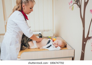 Neurologist Diagnosing Little Boy. Pediatric Examination