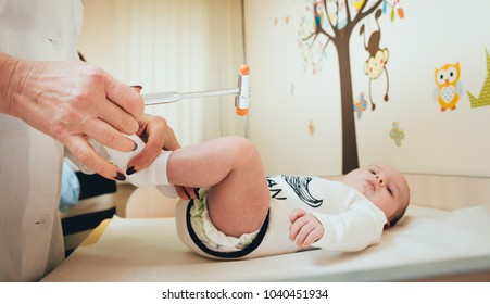 Neurologist Diagnosing Little Boy. Pediatric Examination