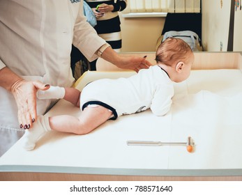 Neurologist Diagnosing Little Boy. Pediatric Examination