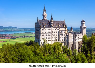 Neuschwanstein Castle, Germany, Europe. Former residence of King Ludwig of Bavaria, famous landmark of German Alps in Munich vicinity. Landscape with castle on mountain top rising over green valley.