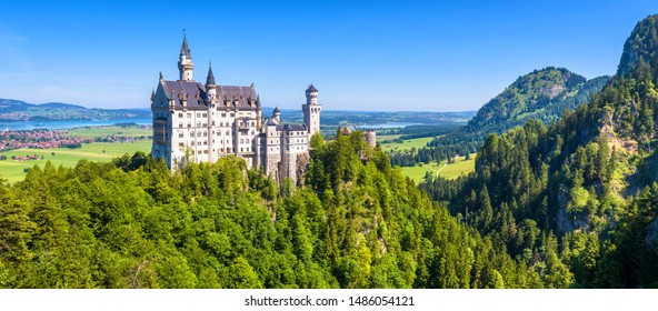 Neuschwanstein Castle In Munich Vicinity, Bavaria, Germany. It Is Landmark In Europe. Landscape With Mountains And Famous Schloss Neuschwanstein. Scenic Panorama Of Nice Old Palace In Alps In Summer.
