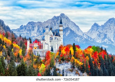Neuschwanstein medieval castle in Germany, Bavaria land. Beautiful autumn scenery of Neuschwanstein ancient castle circled by colorful tree, amazing seasonal fall scene. Famous and popular landmark. - Shutterstock ID 726354187