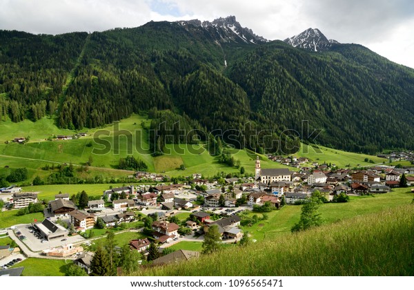 Neustift, Tirol, Austria - May 22, 2018. View over\
Neustift im Stubaital village in Tirol, Austria, with buildigs,\
commercial properties and\
cars.