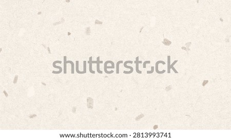 A neutral beige terrazzo surface with flecks, ideal for professional interior design and modern architecture backdrops