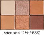 Neutral Eyeshadow Palette with Matte and Shimmer texture, natural colored shades on beige. Set of eyeshadow refills, Top view of six Swatches Eyeshadow makeup for cosmetic, makeup, beauty concept