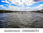 The Neva river with ships carrying tourists, tourist ships and boats, the embankment of the river and canal, canals and bridges in the city, and the canals of St. Petersburg, 