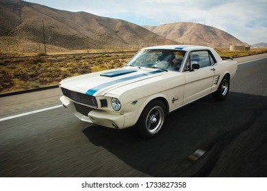 Nevada, Year 2017: Classic Ford Mustang On The Road To Las Vegas To Enjoy The Weekend. Classic Car. American Muscle Car In The Desert. 