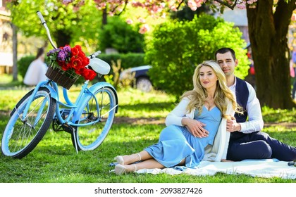 Never Boring. Picnic Of Couple In Love At Vintage Bike. Family Relationship And Friendship. Summer Holiday Trip. Girl And Man Under Sakura. Couple In Love Drinking Wine During Romantic Dinner In Park