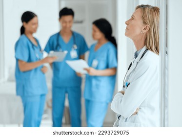 Never to experienced to make a mistake. Shot of a medical practitioner looking stressed in the middle of a meeting in hospital. - Powered by Shutterstock