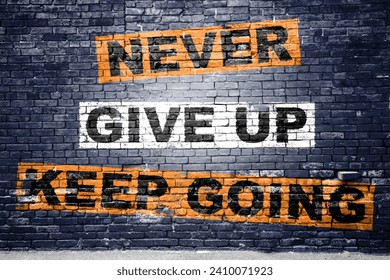 Never Give up keep going saying lettering Graffiti on Brick Wall