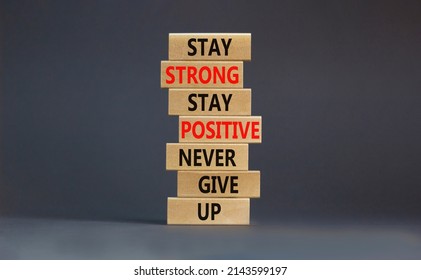 Never Give Up Symbol. Wooden Blocks With Concept Words Stay Strong Stay Positive Never Give Up. Beautiful Grey Background Copy Space. Motivational Business Never Give Up Concept.