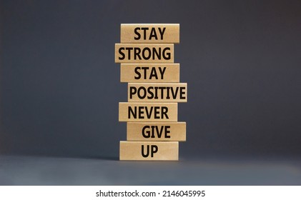 Never Give Up Symbol. Wooden Blocks With Concept Words Stay Strong Stay Positive Never Give Up. Beautiful Grey Background Copy Space. Motivational Business Never Give Up Concept.