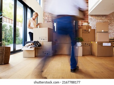 Its never too late to relocate. Shot of a mature couple unpacking boxes on moving day. - Shutterstock ID 2167788177