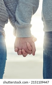 Never Let Me Go. Shot Of An Unidentifiable Couple Holding Hands While Walking Outside.