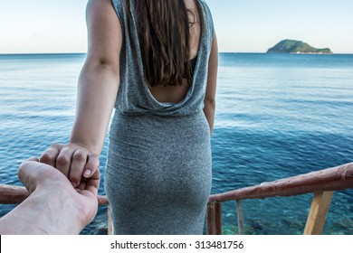 Never Letting Go, Romantic Couple Holding Hands At Water