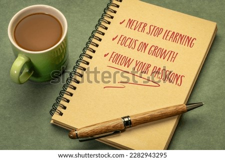 never stop learning, focus on growth, follow your passions - inspirational notes and reminders in a spiral sketchbook, desktop flat lay, personal development concept