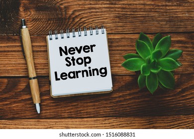 Never stop learning text written in a notebook as a concept - Shutterstock ID 1516088831