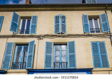Nevers, France - September 23rd 2019: Cute townhouse facade with blue shutters in the historic center of Nevers, located in Burgundy, France