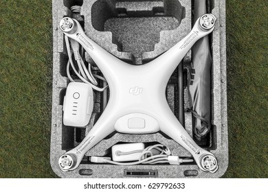 NEVSEHIR, TURKEY - APRIL 22, 2017: DJI Phantom 4 pro quadcopter drone on grass with a copy space.