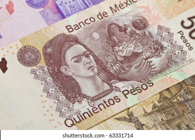 New 500 peso mexican bill closeup showing Frida Kahlo the painter. This is the newest bill as of 2010 on the Mexican currency. Other bills above and below.