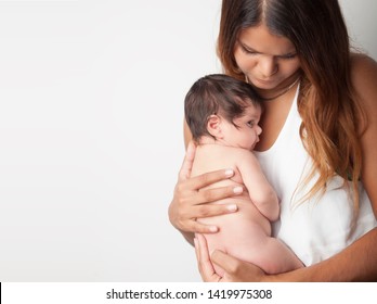 New aboriginal mother holding infant newborn baby girl. 