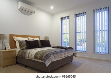 New, air conditioned bedroom with double bed, pillows and covers.