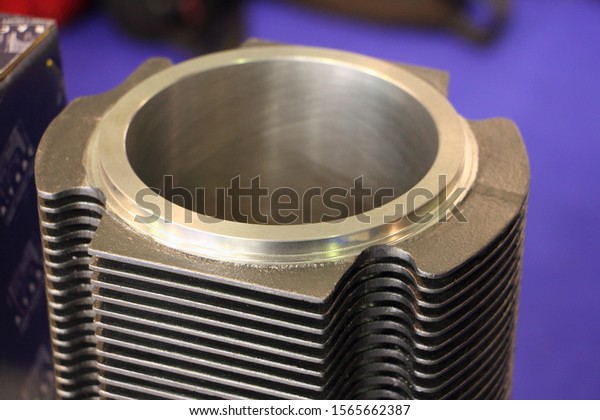 New air cooled car cylinder with honing\
scratches close up, motor engine\
repair