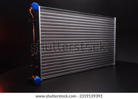 a new aluminum radiator for cooling antifreeze in the car engine