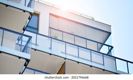 New apartment building with glass balconies. Modern architecture houses by the sea. Large glazing on the facade of the building. - Shutterstock ID 2021796668