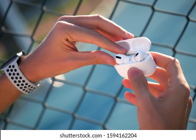 New Apple AirPods outdoor images with Apple Watch Series 4 with white Nike Sport Band. 03.12.2019 Bornova, Izmir, Turkey