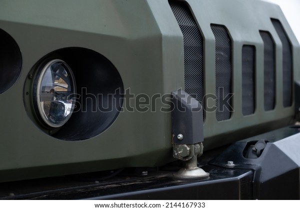 New armored personnel carrier\
armored car of the Ukrainian army. War in Ukraine. 2022. Close\
up.
