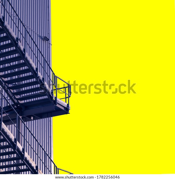 New art, composition with metal stairs on\
a yellow background. Empty space for\
text.
