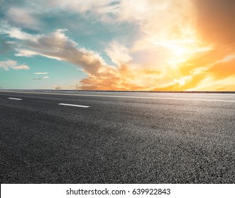 New Asphalt Highway Road At Sunset