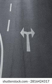 New asphalt texture background featuring an arrow indicating dir