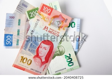new bank notes of mexican peso background. 100, 200, 500, 1000 pesos