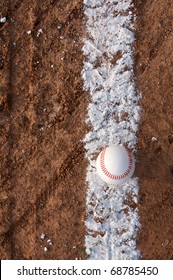 New Baseball on the chalk line of field