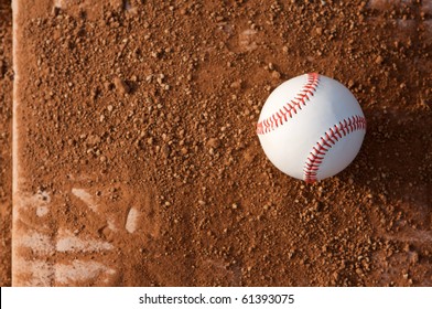 New Baseball On A Dirt Covered Base