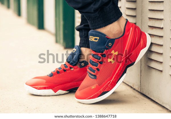New\
beautiful colorful and nice Under Armour running shoes, sneakers,\
trainers shows a brand logo on abstract background. Sport and\
casual footwear concept. Kyiv, Ukraine-MAR 24,\
2019