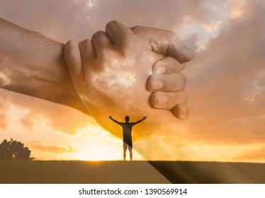 New beginnings and new start. Happy man with open arms facing the sunset. People reaching out for help. Lending a helping hand, and religious concept