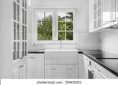 New black and white kitchen with retro details, frontal view