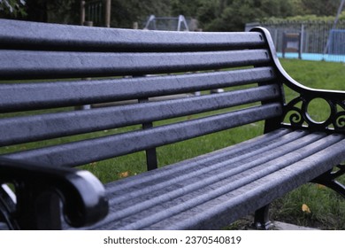 New black wooden park bench, close up - Powered by Shutterstock