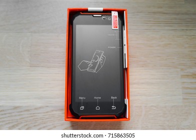 New Black-orange Rugged Smartphone In Box, Front View